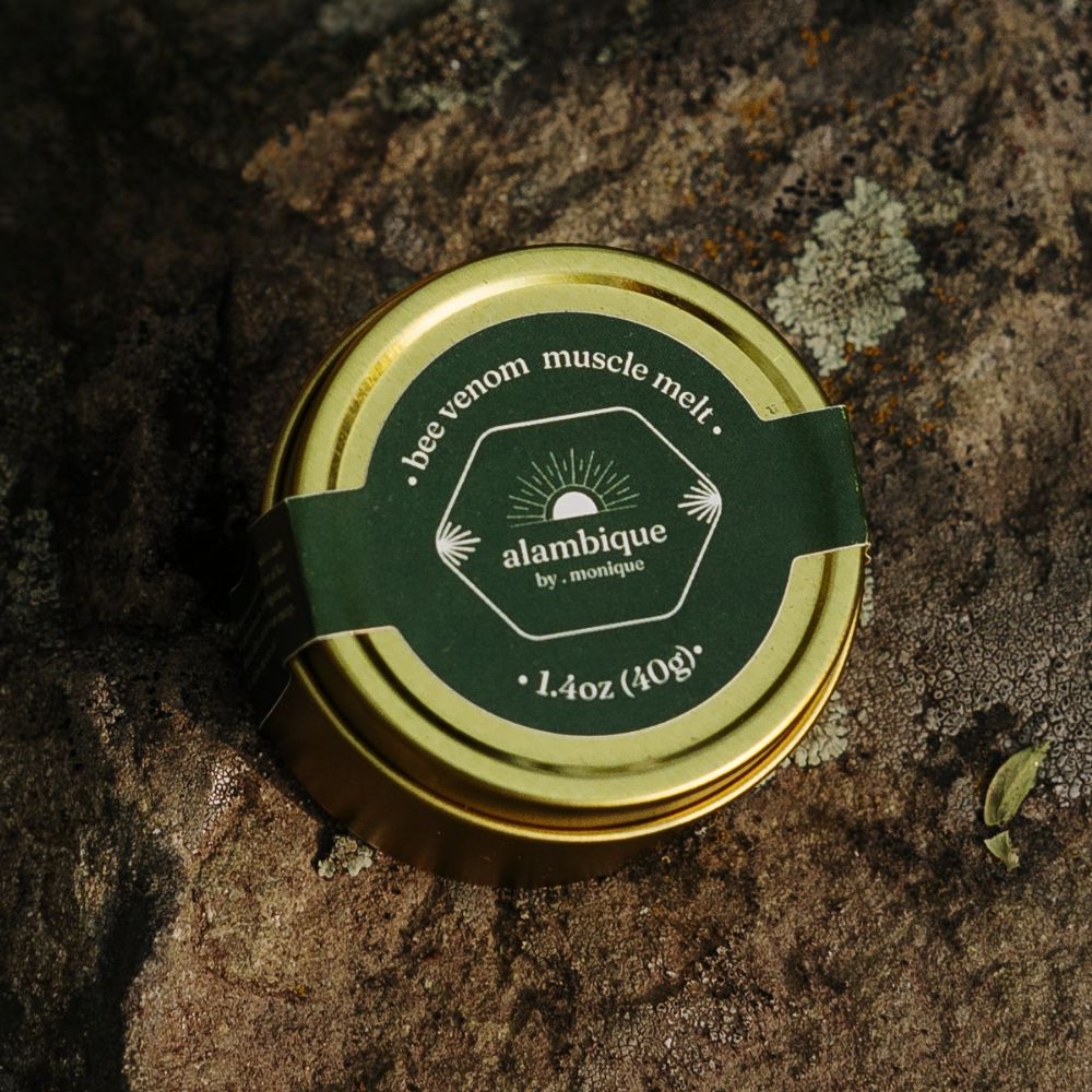 ethical bee venom • muscle melt. the • alambique sitting on a log in nature