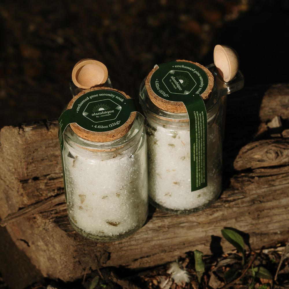 enchanted woods - serenity soak the alambique - sitting on a log with mini wooden spoon