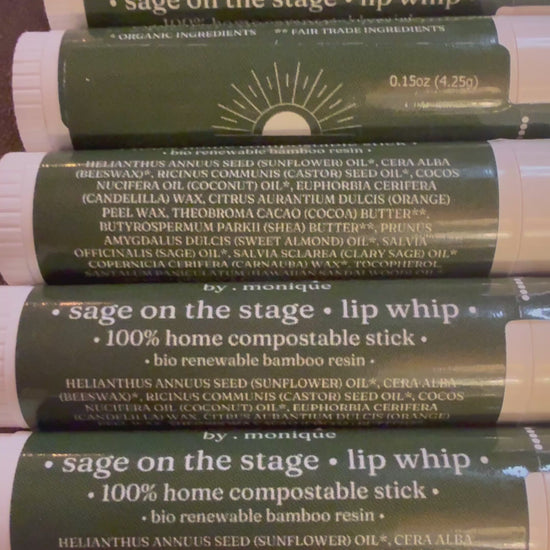 a compostable lip balm stick rolling on a desk