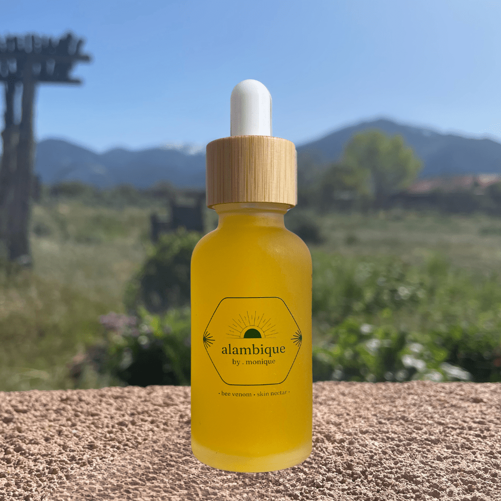 the best ethical bee venom skin serum sitting on a wall in a garden